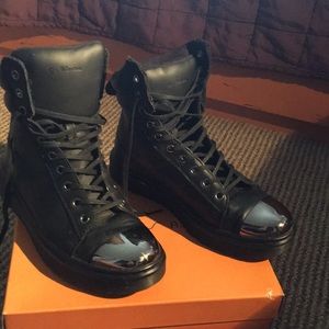 Dr. Martens Black leather high tops.